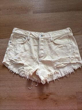 We The Free Pale Cream Distressed Denim Shorts